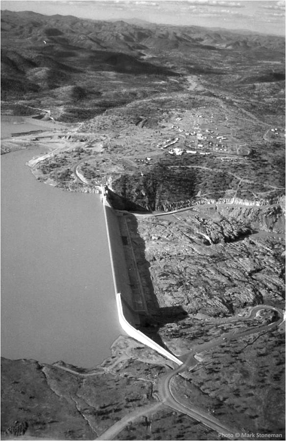 The completed Burdekin Falls Dam in 1987 with dam now filling and construction village being wound down.